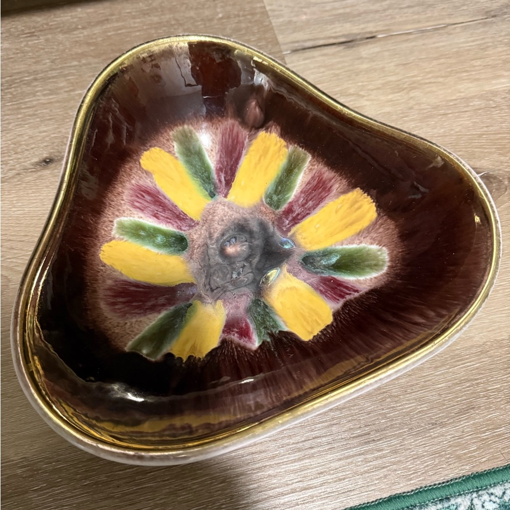 This is a vintage Mid-Century Modern West German pottery triangular dish bowl.